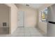Dining area with tile floors and a large window at 113 Glasgow Ct, Davenport, FL 33897