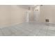 Large living room with tile floors and views into other rooms at 113 Glasgow Ct, Davenport, FL 33897