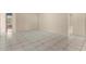 Neutral living room featuring tile floors and neutral-colored walls at 113 Glasgow Ct, Davenport, FL 33897