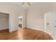 Main bedroom showcasing vaulted ceiling, ceiling fan, and two entryways to closet and bath at 113 Glasgow Ct, Davenport, FL 33897