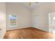 Main bedroom with hardwood floors, ceiling fan, and view of the pool at 113 Glasgow Ct, Davenport, FL 33897
