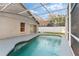 Screened pool features an inviting blue pool and patio at 113 Glasgow Ct, Davenport, FL 33897