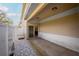 A covered back patio with concrete flooring and stone landscaping at 1132 Hardy Ave Ave, Orlando, FL 32803