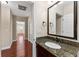 Bathroom vanity with granite countertop and a dark wood cabinet frame at 1132 Hardy Ave Ave, Orlando, FL 32803