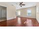 Bedroom featuring hardwood floors, a ceiling fan, and two windows at 1132 Hardy Ave Ave, Orlando, FL 32803