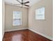 Bedroom with two windows and hardwood flooring at 1132 Hardy Ave Ave, Orlando, FL 32803