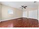 Bedroom with wood floors, ceiling fan, and double closets at 1132 Hardy Ave Ave, Orlando, FL 32803