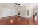 Empty bedroom with wood floors, two closets, and a ceiling fan at 1132 Hardy Ave Ave, Orlando, FL 32803