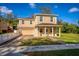 Beautiful two-story home with a covered front porch and attached garage in a suburban setting at 1132 Hardy Ave Ave, Orlando, FL 32803