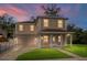 Charming two-story home boasts classic architecture, a covered front porch, and a well-maintained lawn, creating curb appeal at 1132 Hardy Ave Ave, Orlando, FL 32803