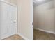 Hallway featuring ceramic tile floors and doors leading to a walk-in closet at 1132 Hardy Ave Ave, Orlando, FL 32803