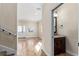 Hallway view features tile flooring, staircase, and a half bathroom at 1132 Hardy Ave Ave, Orlando, FL 32803