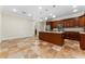 Spacious kitchen featuring wood cabinetry, stainless steel appliances, and granite island at 1132 Hardy Ave Ave, Orlando, FL 32803