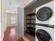 A laundry room with washer, dryer, and a storage shelf at 1132 Hardy Ave Ave, Orlando, FL 32803