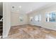 Bright living room features tile flooring, recessed lights, and a front door with sidelight windows at 1132 Hardy Ave Ave, Orlando, FL 32803