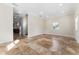 Spacious living room featuring tile floors, recessed lighting, and large windows for ample natural light at 1132 Hardy Ave Ave, Orlando, FL 32803