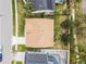 Aerial view of a home showing the backyard and the roof with two skylights at 13506 Crystal River Dr, Orlando, FL 32828