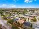 An aerial shot of the property shows its location within a suburban neighborhood surrounded by greenery and community amenities at 13506 Crystal River Dr, Orlando, FL 32828