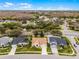 An aerial view of a home with a well-manicured front yard and a clear view of the surrounding neighborhood at 13506 Crystal River Dr, Orlando, FL 32828