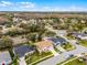 An aerial view captures the property's proximity to a road, with a clear view of neighboring homes and greenery at 13506 Crystal River Dr, Orlando, FL 32828
