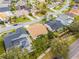 Overhead shot exhibits a backyard pool plus solar panels among green landscaping in a neighborhood at 13506 Crystal River Dr, Orlando, FL 32828