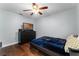 Comfortable bedroom features a bed, dark wood floors, and plenty of space, perfect for relaxing at 13506 Crystal River Dr, Orlando, FL 32828