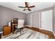 Bedroom featuring hardwood floors, ceiling fan, closet, and neutral-toned walls for a calm and inviting space at 13506 Crystal River Dr, Orlando, FL 32828