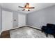 Bedroom features a ceiling fan, a neutral color scheme, and an accent chair at 13506 Crystal River Dr, Orlando, FL 32828