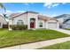 Attractive single Gathering home featuring mature landscaping and an attached garage at 13506 Crystal River Dr, Orlando, FL 32828