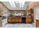 Spacious kitchen with ample countertop space, skylights, and modern appliances, perfect for cooking and entertaining at 13506 Crystal River Dr, Orlando, FL 32828