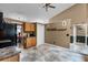 Well-lit kitchen featuring tile floors, wood cabinets, and views into the dining room, creating a functional space at 13506 Crystal River Dr, Orlando, FL 32828