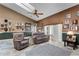 Spacious living room featuring comfortable seating, neutral color scheme, and natural lighting at 13506 Crystal River Dr, Orlando, FL 32828