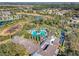 A captivating aerial shot of the community pool, clubhouse, and surrounding neighborhood at 1382 Hayton Ave, Deland, FL 32724