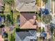 Aerial view showcasing the home's roof, screened lanai, expansive yard, and neighborhood at 1382 Hayton Ave, Deland, FL 32724