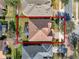 Aerial view showcasing the home's roof, screened lanai, expansive yard, and neighborhood at 1382 Hayton Ave, Deland, FL 32724