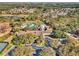 A breathtaking aerial view of the community center with a pool, lush landscaping, and well-kept grounds at 1382 Hayton Ave, Deland, FL 32724
