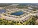 A beautiful aerial view of homes surrounding a pristine lake within a thoughtfully designed community at 1382 Hayton Ave, Deland, FL 32724
