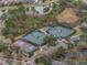 An overhead shot of the community's tennis and pickleball courts, with lush greenery and parking available at 1382 Hayton Ave, Deland, FL 32724