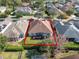 Aerial view of backyard with screened-in porch in a well-defined yard at 1382 Hayton Ave, Deland, FL 32724