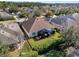 Aerial view of a backyard with a screened-in porch and well-maintained lawn at 1382 Hayton Ave, Deland, FL 32724