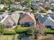 Aerial view of backyard with screened-in porch in a well-defined yard at 1382 Hayton Ave, Deland, FL 32724