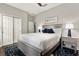 Bedroom featuring a bed with a blue rug, white bedding, and a ceiling fan at 1382 Hayton Ave, Deland, FL 32724