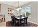Bright dining area with large windows, plantation shutters, and stylish light fixture at 1382 Hayton Ave, Deland, FL 32724
