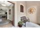 Inviting entryway with tiled floors, an ornate sun decoration, and a bench at 1382 Hayton Ave, Deland, FL 32724