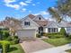 Beautiful home with a brick driveway, two-car garage, and well-maintained landscaping at 1382 Hayton Ave, Deland, FL 32724
