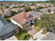 Aerial view of a charming single-Gathering home with a well-kept lawn and brick driveway at 1382 Hayton Ave, Deland, FL 32724