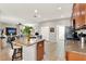 Open kitchen features stainless appliances, granite counters, and a breakfast bar, flowing to living areas at 1382 Hayton Ave, Deland, FL 32724