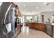 Spacious kitchen with stainless steel appliances and a tile floor, with a view into the dining area at 1382 Hayton Ave, Deland, FL 32724