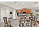Open concept kitchen with granite counters, breakfast bar and tile floors offers lots of space and storage at 1382 Hayton Ave, Deland, FL 32724
