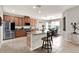 Spacious kitchen features stainless steel appliances, granite counters and an eat-in island with barstool seating at 1382 Hayton Ave, Deland, FL 32724